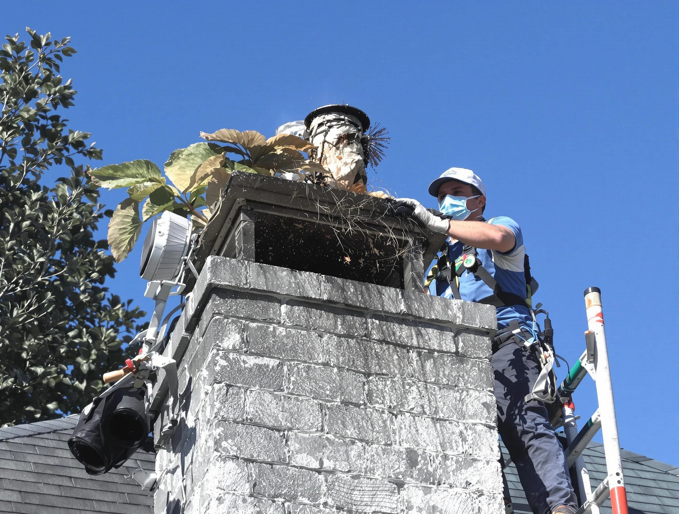 Plainsboro Chimney Sweep specialist performing chimney cleaning in Plainsboro, NJ